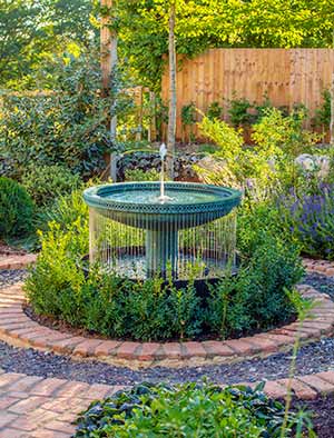 Mimeo Cascade as the focal point of a classically styled garden